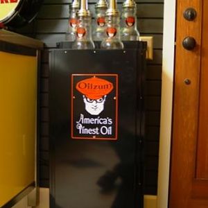 This is an Art Deco oil bottle stand.  Back in the 1930's these would have stood at gas stations across America promoting brands of oil.  This Oilzum