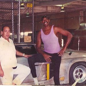 with Wilt Chamberlain circa 1990 at LAX picking up the car we designed!