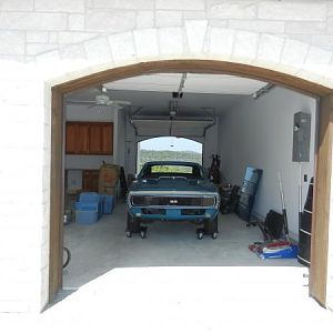 Camaro in wash bay of new home