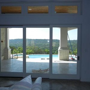 View out disappearing glass wall.  Come fall, we will keep it open.  Same stone floor inside and out!