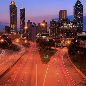 2010-198653-the-atlanta-skyline-at-dusk-with-traffic-streaming-through-the-city-atlanta-mo1